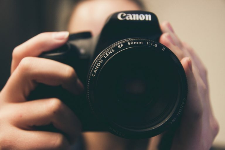 a person holding a camera