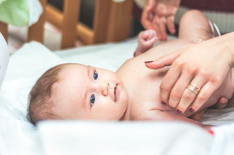 a baby lying on its back