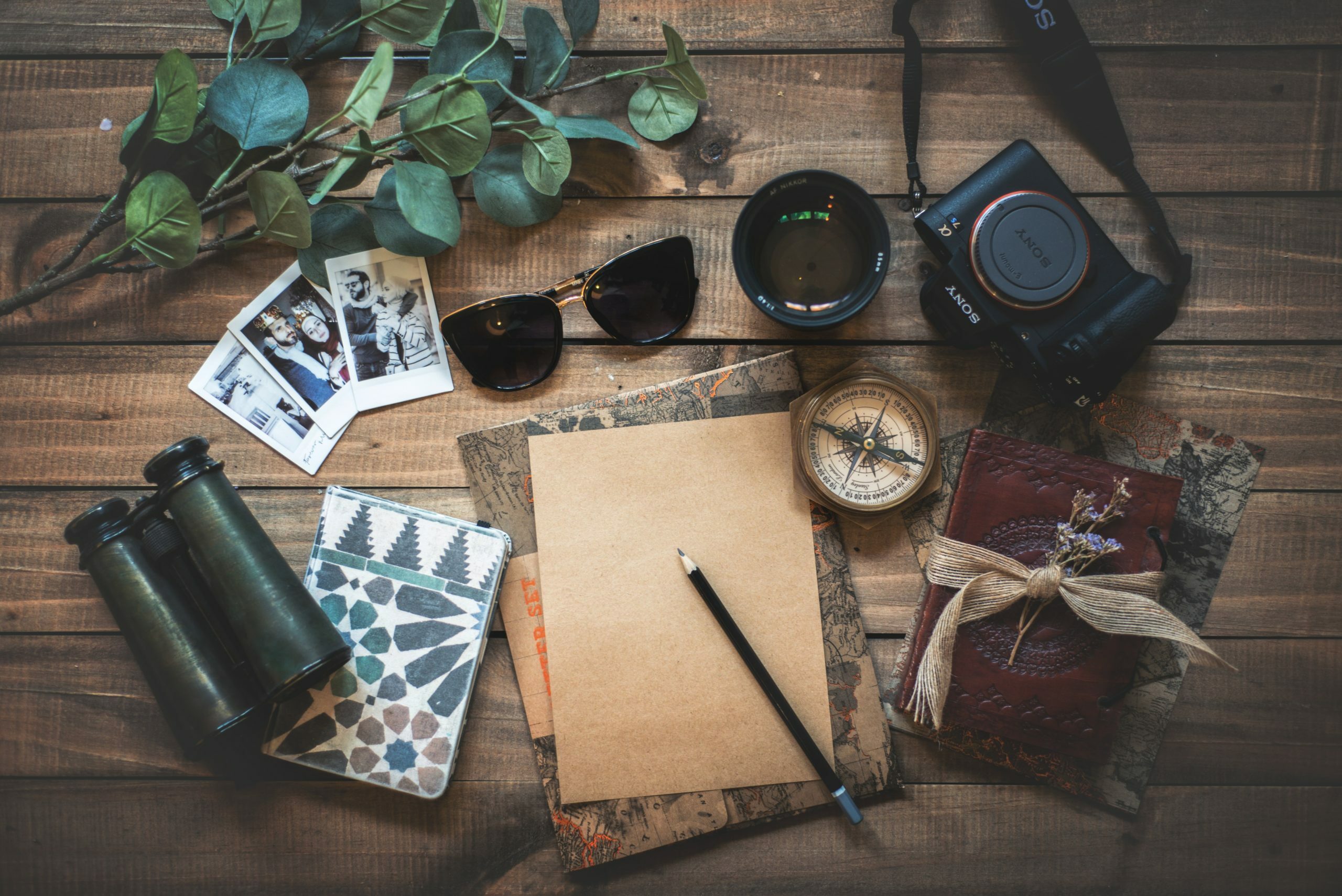 a table with a book and sunglasses