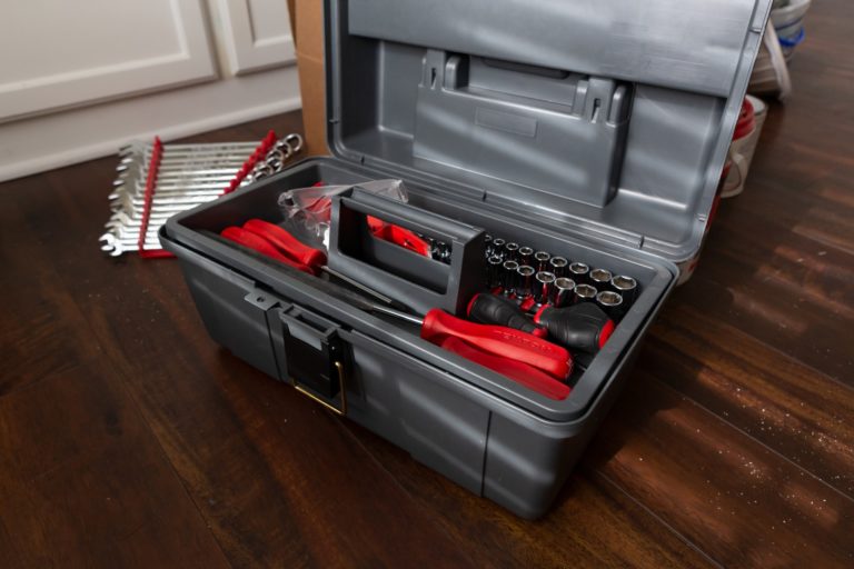 a stove with a red hood