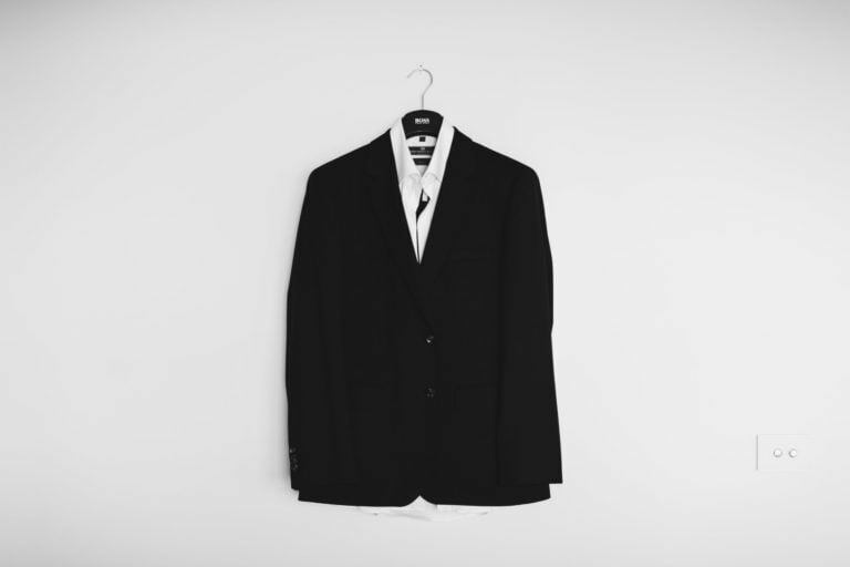 a black shirt with a white tie