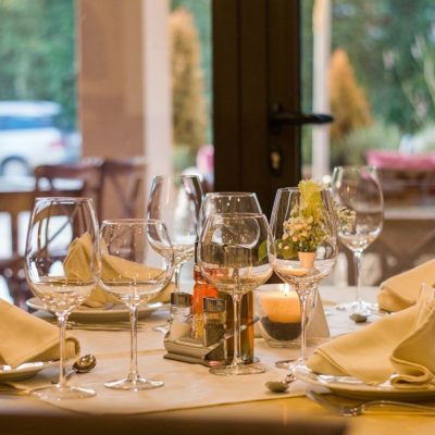a table with wine glasses and food