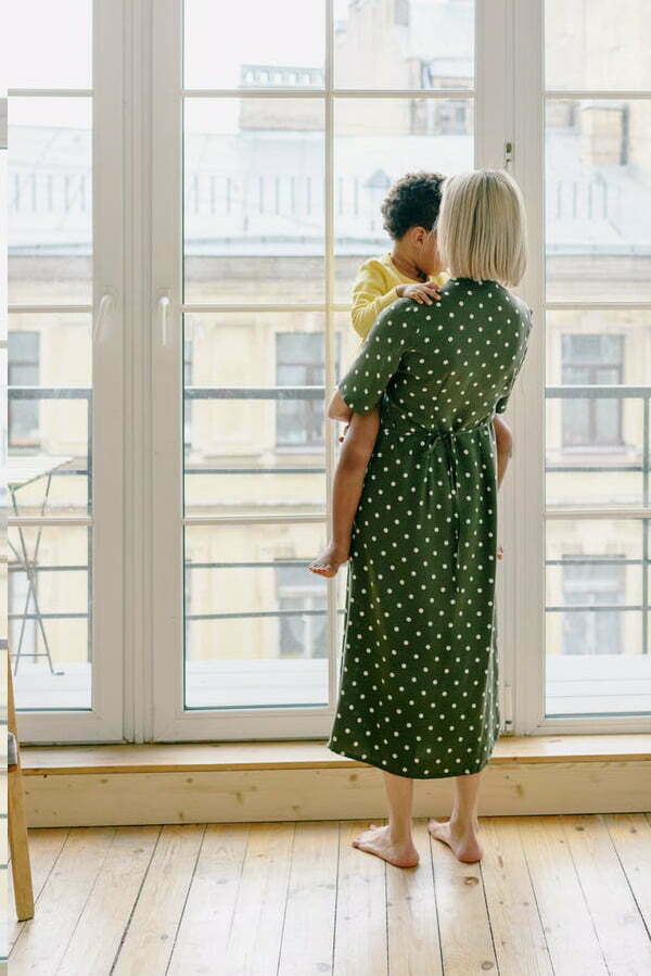 a woman kissing a man on the cheek